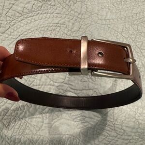 Reversible black/brown leather belt with silver-tone buckle, size stamped 24/60